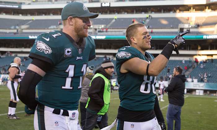 Wentz and Zach walk off after the win.